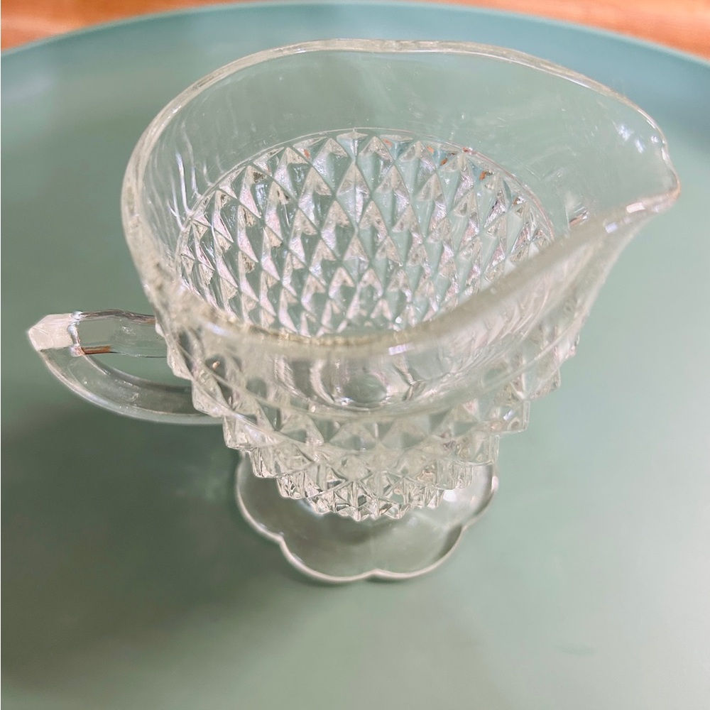 Vintage Indiana Glass Diamond point footed creamer scallop base. Mint condition.